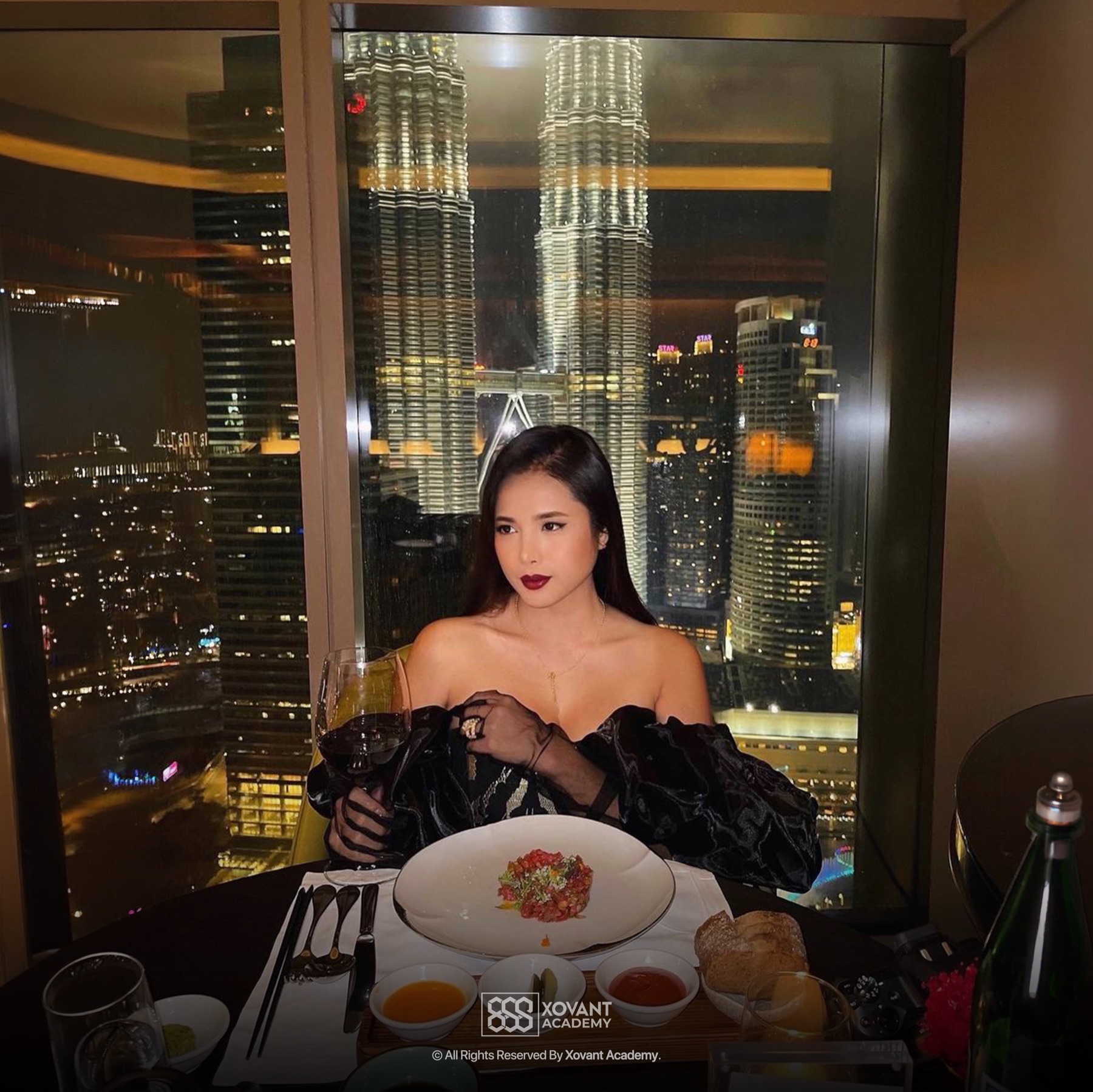 Dr Ilizah at an evening dinner overlooking the Kuala Lumpur skyline