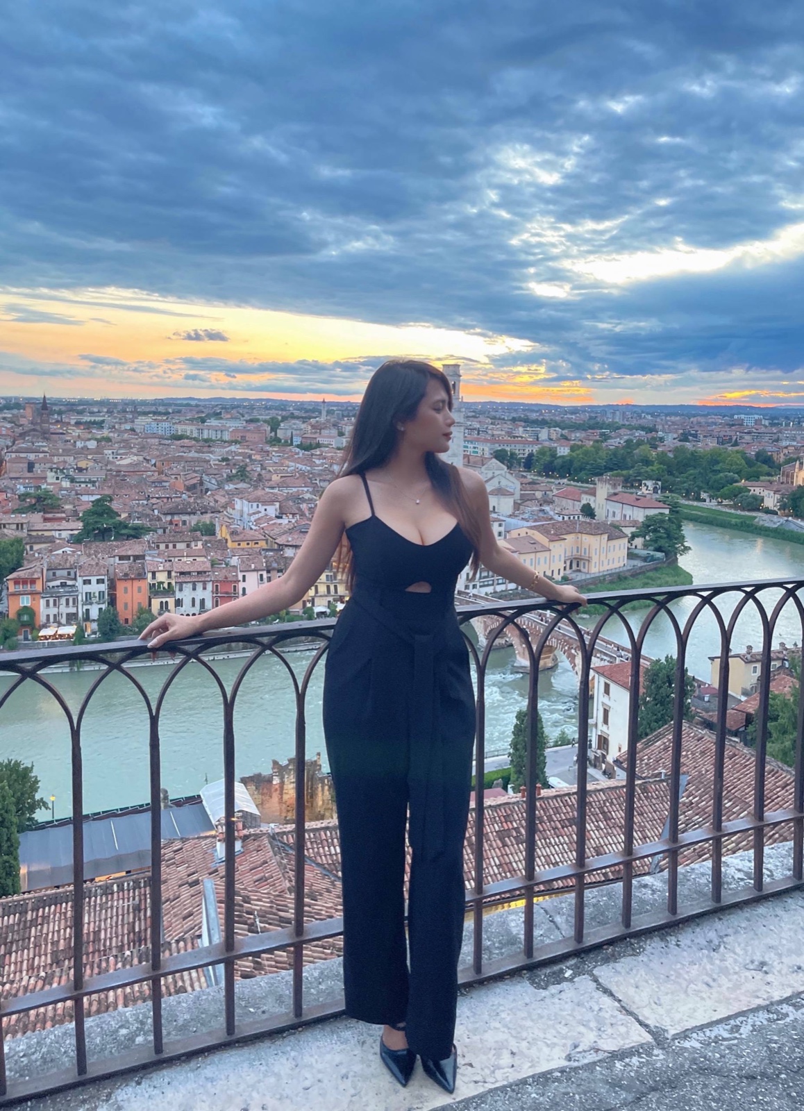 Dr Ilizah watching the sunset over Verona, Italy